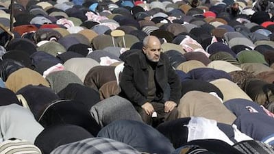 Jordanians pray on Friday before a protest to demand the boycott of Wednesday's parliamentary elections. Mohamad Rafaya / EPA
