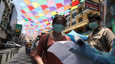 Residents queue for a coronavirus nasal swab test, in Bangkok, Thailand. Reuters