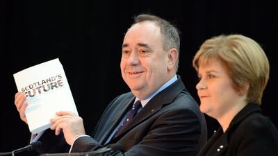 Scottish first minister Alex Salmond, left, and deputy first minister Nicola Sturgeon present the White Paper for Scottish independance at the Science Museum Glasgow. Jeff J Mitchell / Getty Images