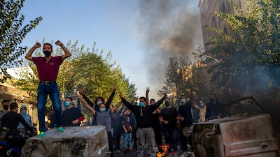 Iranians protests the death of 22-year-old Mahsa Amini after she was detained by the morality police in September 2022, in Tehran. AP