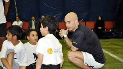 Edward van Gils speaks to children during the Streetkings Football Academy session at the Dome@Rowhdat in Abu Dhabi.