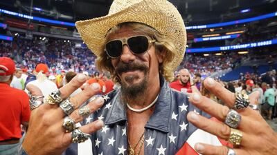 A supporter poses for photo before Donald Trump holds a campaign kick off rally at the Amway Center in Orlando, Florida. Reuters