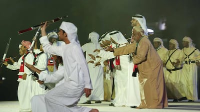Emirati men performing the traditional dance during the 42nd National Day celebrations. Antonie Robertson/The National