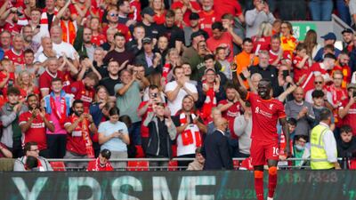 Sadio Mane celebrates after scoring the opening goal for Liverpool at Anfield. AFP