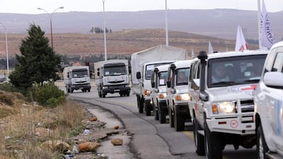 Aid convoys head from Damascus to the besieged town of Madaya last year. Louai Beshara / AFP