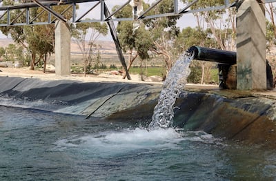 Water is pumped from a well into a pond to irrigate a farm in Kasserine, west-central Tunisia. Reuters