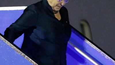 Chilean president Michelle Bachelet walks down a stairway from her plane. Wallace Woon / EPA