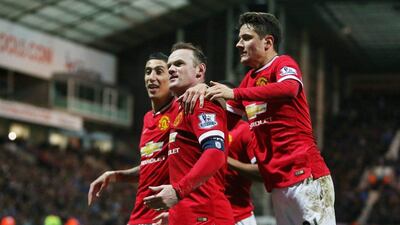 Wayne Rooney, centre, celebrates his penalty that put Manchester United 3-1 up against Preston. Ander Herrera, right, equalised for the Premier League club. Carl Recine / Reuters