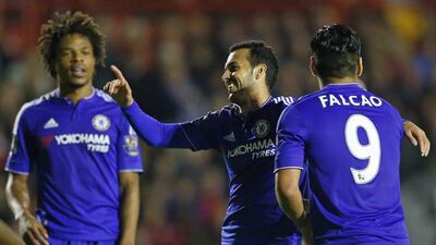 Loic Remy, left, Pedro, centre, and Falcao celebrate Chelsea's fourth gaol against Walsall. Eddie Keogh / Reuters