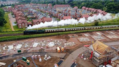 A steam train from the Great Central Railway passes between new housing developments in Loughborough, UK. Britain's housing market accelerated after finance minister Rishi Sunak unveiled a tax break in July last year. Bloomberg