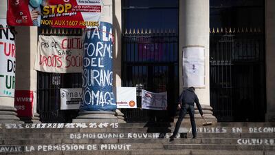 A man cleans the stairs of the occupied Theatre Graslin by culture workers, in Nantes. The workers are demanding the reopening of cultural places and theatres. AFP