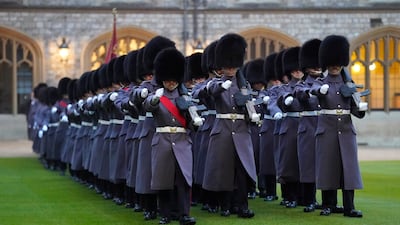Members of the 1st Battalion Welsh Guards, march into the quadrangle before performing a guard of honour for King Abdullah. PA