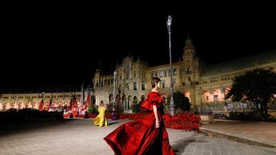 A blood-red gown at the show in Seville. Reuters