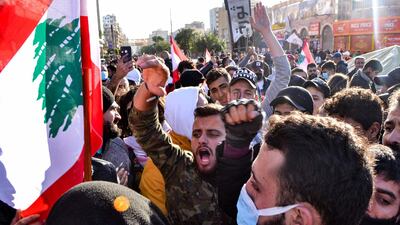 Anti-government protesters chant slogans during a demonstration in the centre of Lebanon's impoverished northern port city of Tripoli on January 31, 2021. AFP