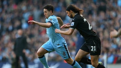 Samir Nasri of Manchester City dribbles past George Boyd of Burnley during their 2-2 Premier League draw on Sunday at the Etihad Stadium. Alex Livesey / Getty Images / December 28, 2014