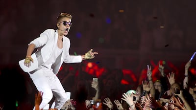 epa03661194 Canadian singer Justin Bieber performs during a concert at The GelreDome Stadium in Arnhem, The Netherlands, 13 April 2013. EPA/PAUL BERGEN *** Local Caption *** 03661194.jpg