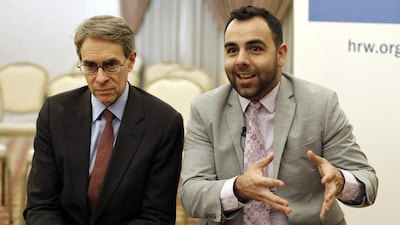 Kenneth Roth (L) and Omar Shakir speak during an interview at an east Jerusalem hotel, on November 24, ahead of his expulsion from Israel. AFP