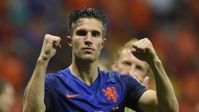 Robin van Persie celebrates at the end of the Group B match between Spain and the Netherlands at the Fonte Nova Arena in Salvador during the 2014 Fifa World Cup on June 13, 2014. Lluis Gene / AFP