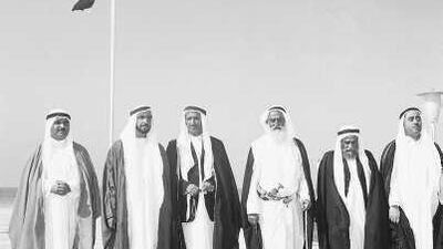 From left to right, the late Sheikh Khalid bin Mohammed, the Ruler of Sharjah; the late Sheikh Zayed, the President of the UAE and Ruler of Abu Dhabi; the late Sheikh Rashid bin Saeed, the Ruler of Dubai; the late Sheikh Rashid bin Humayd, the Ruler of Ajman; the late Sheikh Mohammed bin Hamad, the Ruler of Fujairah; and the late Sheikh Rashid bin Ahmad, the Crown Prince of Umm Al Qaiwain; in front of the guest palace - now known as Union House, left - in 1971.