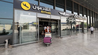 An Iranian passenger leaves Najaf International Airport on Wednesday. Reuters