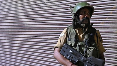 An Indian paramilitary trooper stands guard at a roadblock at Maisuma locality in Srinagar on August 4, 2019. AFP