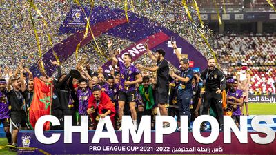 Al Ain players celebrate their win at the Pro League Cup final against Shabab Al Ahli at Mohamed bin Zayed Stadium in Abu Dhabi.