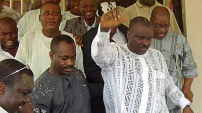 James Ibori, right, leaves a Nigerian coutroom last year. A UAE court has approved his extradition to the UK.
