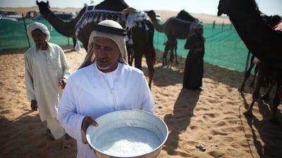 Fresh camel milk is kept in a large bowl for people to enjoy at a milking competition at the Camel Festival in Madinat Zayed in 2010. Galen Clarke / The National