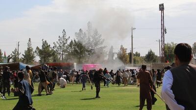 People react after a twin bomb blasts targeting the Farmers Day ceremony attended by the Governor of Helmand province, in Helmand, Afghanistan. EPA