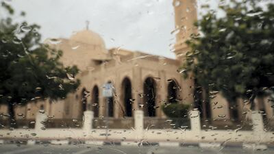 Dark clouds and rain at a mosque, Jumeriah, Dubai. Chris Whiteoak / The National