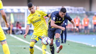 Chievo's Fabio Depaoli and Juventus' Cristiano Ronaldo in action. EPA