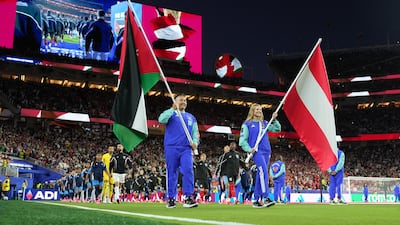 Jordan and Austria players walk out for the national anthems. Reuters