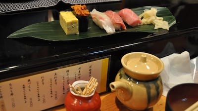 A sushi breakfast at Iwasa Sushi, one of a handful of restaurants next to Tsukiji market's main buildings. Rosemary Behan / The National