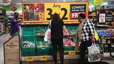Shoppers at a supermarket in London. Retail analyst Kantar says grocery price inflation has fallen for the fourth month in a row as supermarkets push promotions. EPA