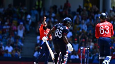England spinner Adil Rashid celebrates after bowling USA's Aaron Jones for 10. AFP
