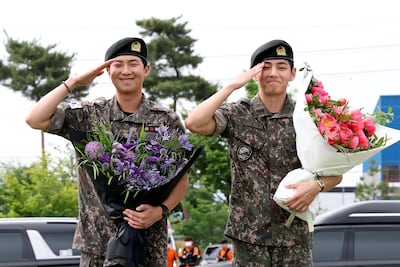 In the footsteps of Elvis: Two members of K-pop band BTS on discharge from military service. Getty Images