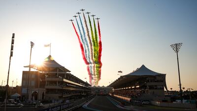 A flypast by Etihad Airways and Al Fursan aerobatics team during the UAE national anthem before the start of the Abu Dhabi Grand Prix at Yas Marina Circuit. Victor Besa / The National