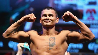 Marcos Maidana poses during his weigh-in for Saturday's title fight rematch against Floyd Mayweather. Al Bello / Getty Images / AFP / September 12, 2014
