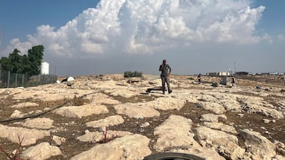 A Palestinian man packs up his home in the occupied West Bank village of Zanuta, following a sharp rise in settler attacks. Thomas Helm / The National
