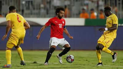 Salah in action with Guinea's Issiaga Sylla. Reuters