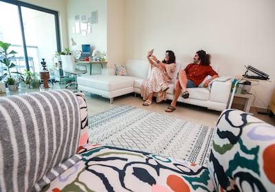 The natural light, large windows and view are among the reasons the couple enjoy their Dubai Marina apartment. Victor Besa / The National
