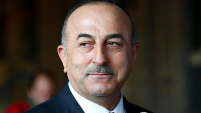 Turkish foreign minister Mevlut Cavusoglu, seen here at a news conference in Goslar, Germany, on January 6, 2018, says he will travel to Baghdad later this month to help mediate talks between the Iraqi government and Erbil. Ralph Orlowski / Reuters