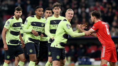 Bayern Munich's Leon Goretzka and Manchester City's Erling Haaland tangle. AFP