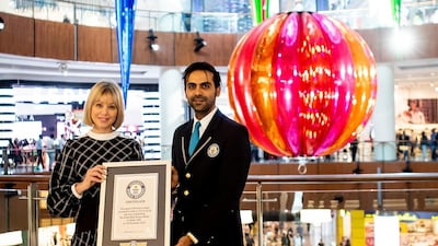 Rebecca Jobo, head of The Dubai Mall, receives the Guinness World Record award. The Dubai Mall