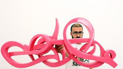 The Tunisian artist eL Seed says his latest exhibition is a statement of love for calligraphy, an ageing art that he says deserves to be honoured. Satish Kumar / The National