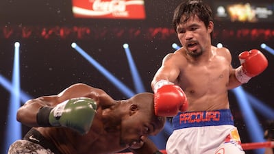 Manny Pacquiao goes on the attack against Timothy Bradley in 2014. AFP