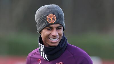 Marcus Rashford is all smiles during training in Manchester. Getty