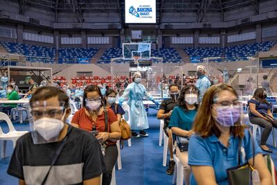 Filipinos queue to receive Russian Sputnik vaccine at a sports arena in Manila this week. Getty Images