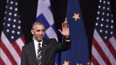 Barack Obama waves to the crowd after delivering a speech in Athens on November 16. Aris Messinis / AFP