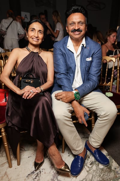 Rama Raju Mantena with his wife Padmaja at Paris Fashion Week in July. Getty Images